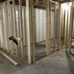 Before buildout. Unfinished basement needed room separations, insulation and doors.