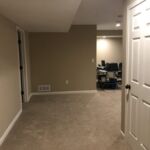 New carpet, doors and painted walls makes this room new usable space.